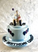 Birthday-cake-with-sugar-figures-with-grandad-and-grand-children-