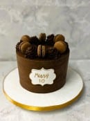 Chocolaste-birthday-cake-with-macrons-and-swirls