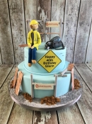 construction man building birthday cake