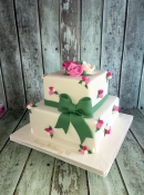 pretty vintage birthday cake with flowers and sugar bow
