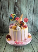 chocolate drip with candy and sweets birthday cake