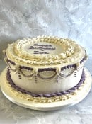 buttercream-birthday-cake-with-with-ovderlayed-piping-and-drop-lines-