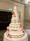 Extra-large-wedding-cake-with-gold-and-sugar-roses