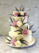 Combed-buttercream-wedding-cake-with-silk-and-lavernder-flowers-