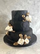 black-buttercream-wedding-cake-with-skulls