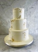 buttercream-wedding-cake-with-gold-leaf-and-pearls