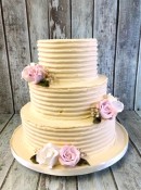 combed-buttercream-wedding-cake-with-sugar-flowers-