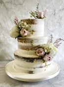 semi-naked-buttercream-wedding-cake-with-silk-flowers-