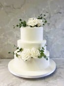 white-buttercream-wedding-cake-with-silk-roses-