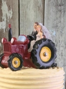 bride and groom on tractor wedding cake topper