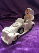 bride and groom in a wedding cake cake topper