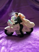 bride and groom on motor bike