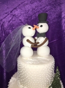 snow man and woman wedding cake topper