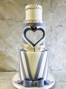 Hallow-Heart-swan-wedding-cake-withn-dramatic-stripes