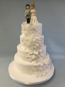 Rose and sugar figures wedding cake