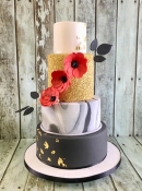 black and gray marbel cake with gold sequins and red poppies wedding cake dublin ireland bray