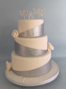 Roses and silver wrap wedding cake