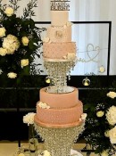Ombre-pink-wedding-cake-with-diamante-and-sugar-roses-on-a-crystal-stand-