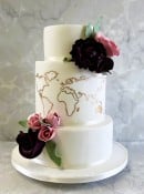 World-map-and-hand-made-sugar-roses-and-Peony-flowers-wedding-cake-