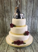 bride and groom on bike wedding cake