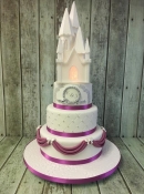 caste wedding cake with sugar drapes