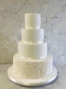 classic-White-wedding-cake-with-pearls-an-deep-rosettes