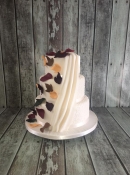 drape and autum leaves wedding cake