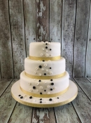 gold and black blossoms wedding cake