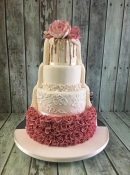 gold drip wedding cake with pink vintage ruffles
