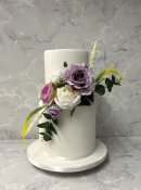 iced-barrelled-wedding-cake-with-silk-flowers-