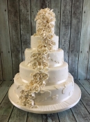 ivory roses and lace wedding cake