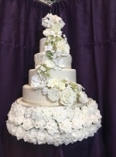 large cascading mixed flowers wedding cake