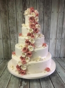 pink cascading roses wedding cake