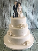 roses and pearl wedding cake with sugar cake toppers