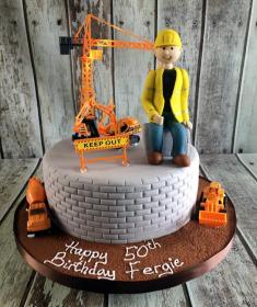 Building construction man birthday cake