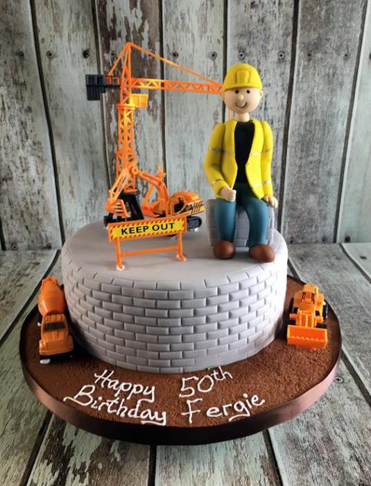 Building construction man birthday cake