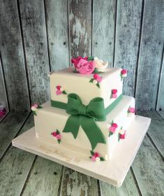 pretty vintage birthday cake with flowers and sugar bow