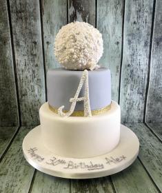 elegant silver and white cake with pearl ball birthday cake