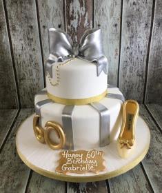 gold and silver bow birthday cake