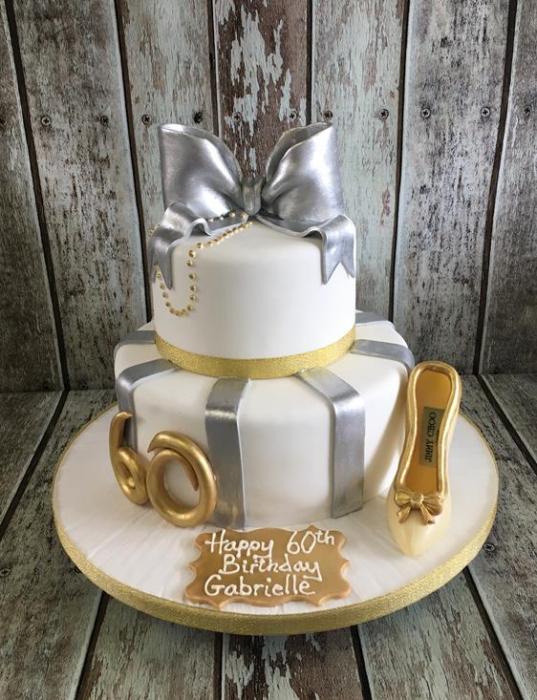 gold and silver bow birthday cake