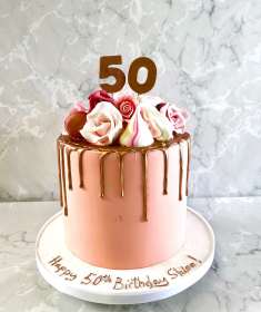 Drip style birthday cake with sugar flowers and meringues 