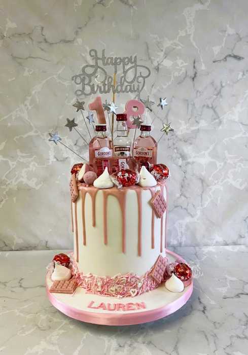 Drip style birthday cake with mini pink gin bottles