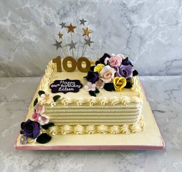 100 year old birthday cake with edible roses and a buttercream finish
