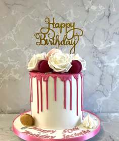 Pink-drip-birthday-cake-with-silkl-flowers-