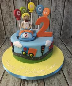 boy in car birthday cake