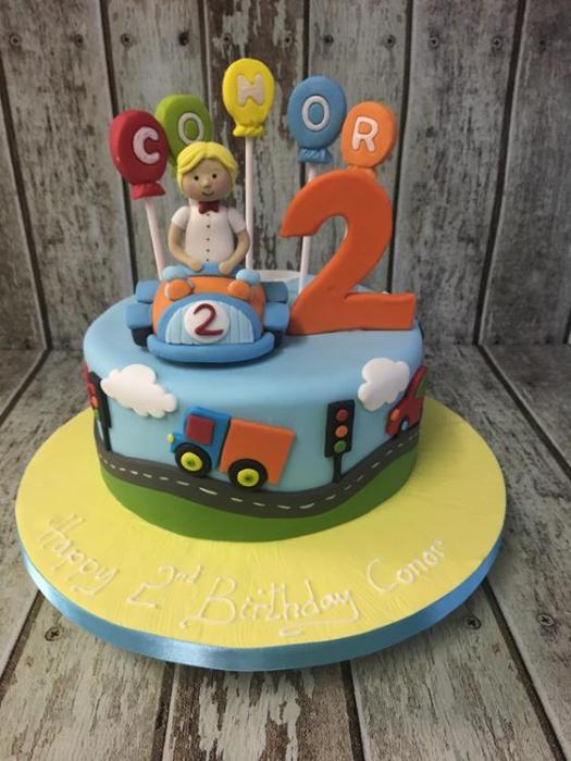 boy in car birthday cake
