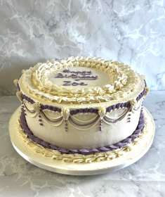 buttercream-birthday-cake-with-with-ovderlayed-piping-and-drop-lines-