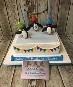 penguin ice scating birthday cake