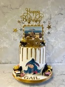 Drip style birthday cake with sugar cut-outs and  sweets 