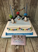 penguin ice scating birthday cake